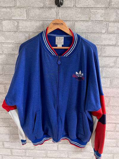 Vintage Adidas Blue track Jacket.  Blue with red and white trim.